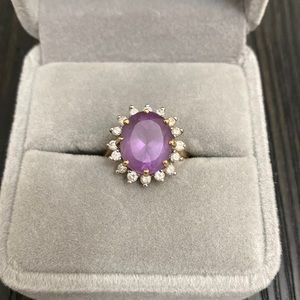 14 karat gold 1/2 carat total diamond and amethyst ring.